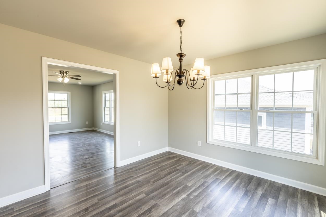 125 Rhodes Hill Drive Dayton, VA 22821 - Photo 20 of 37 a view of a livingroom with a chandelier wooden floor and chandelier