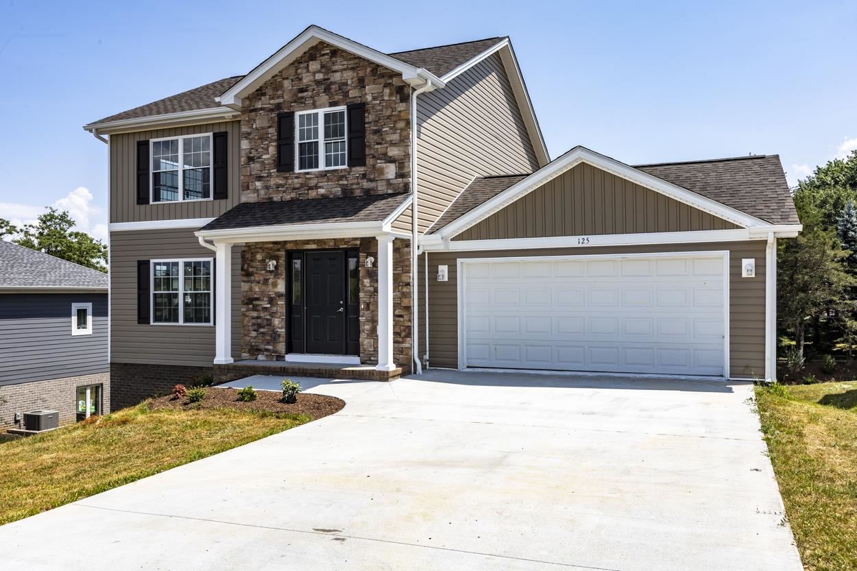 125 Rhodes Hill Drive Dayton, VA 22821 - Photo 2 of 37 a front view of a house with a yard
