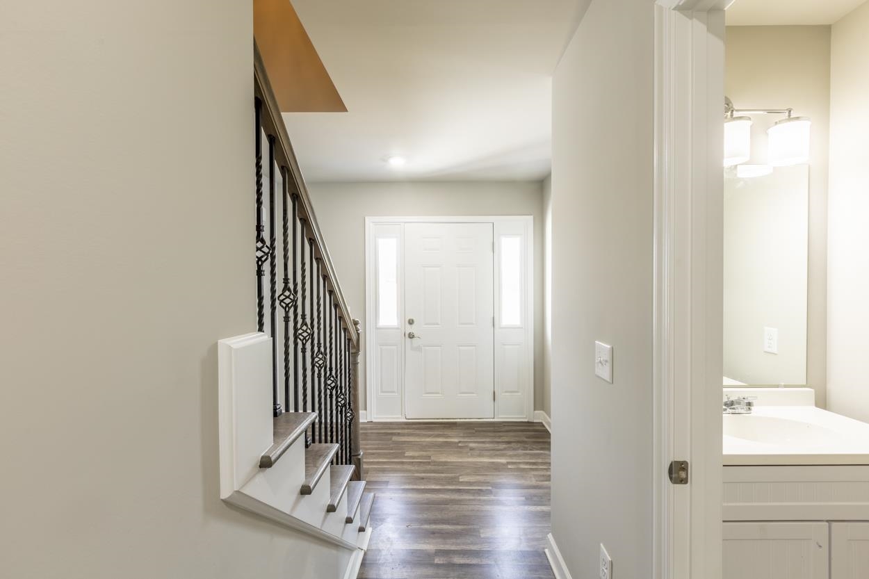 125 Rhodes Hill Drive Dayton, VA 22821 - Photo 22 of 37 a view of a hallway with wooden floor and staircase