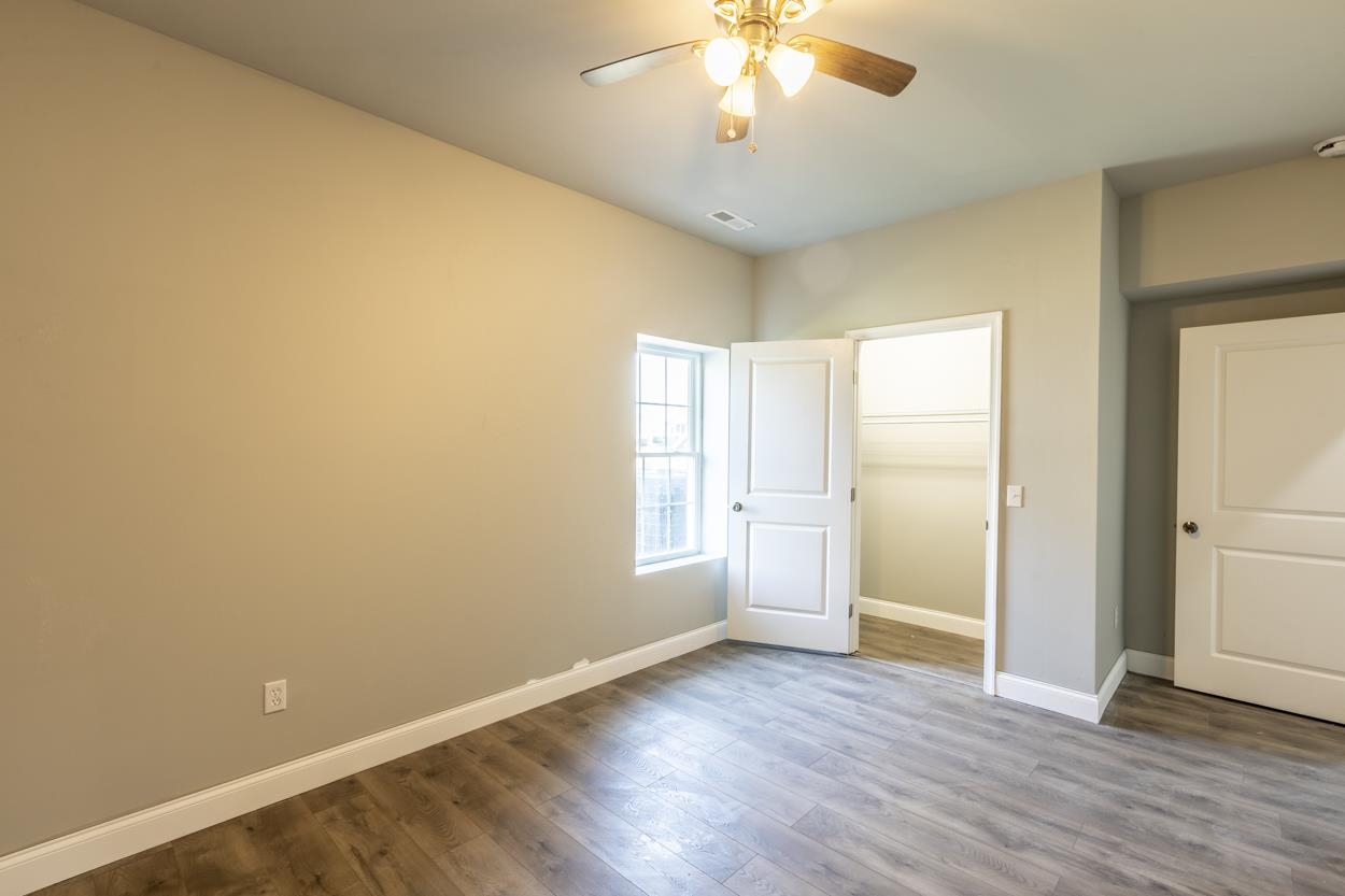 125 Rhodes Hill Drive Dayton, VA 22821 - Photo 27 of 37 an empty room with wooden floor and windows
