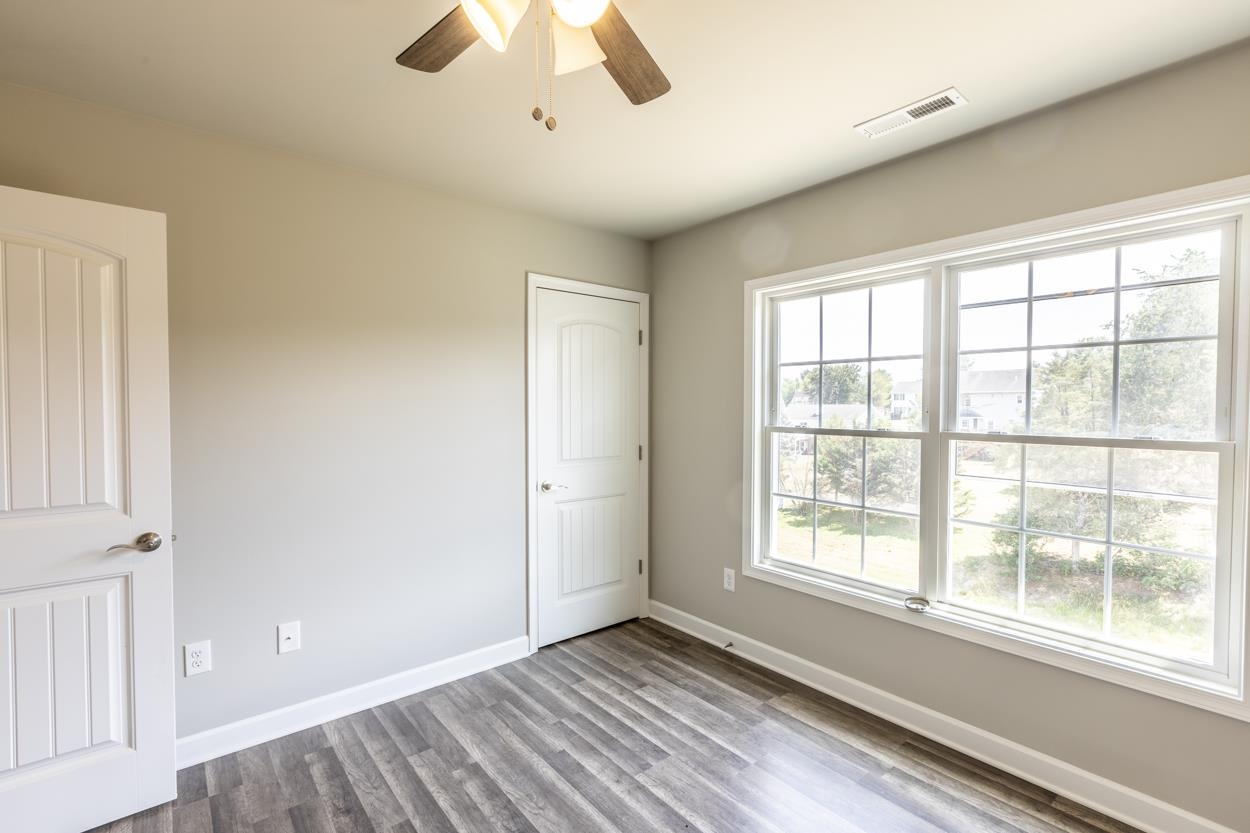125 Rhodes Hill Drive Dayton, VA 22821 - Photo 28 of 37 a view of an empty room with a window and wooden floor
