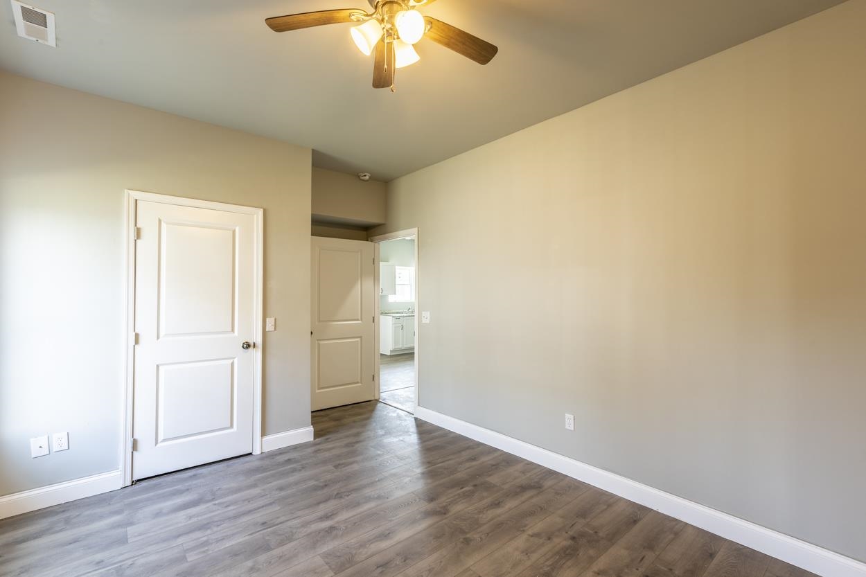 125 Rhodes Hill Drive Dayton, VA 22821 - Photo 29 of 37 an empty room with wooden floor and chandelier fan