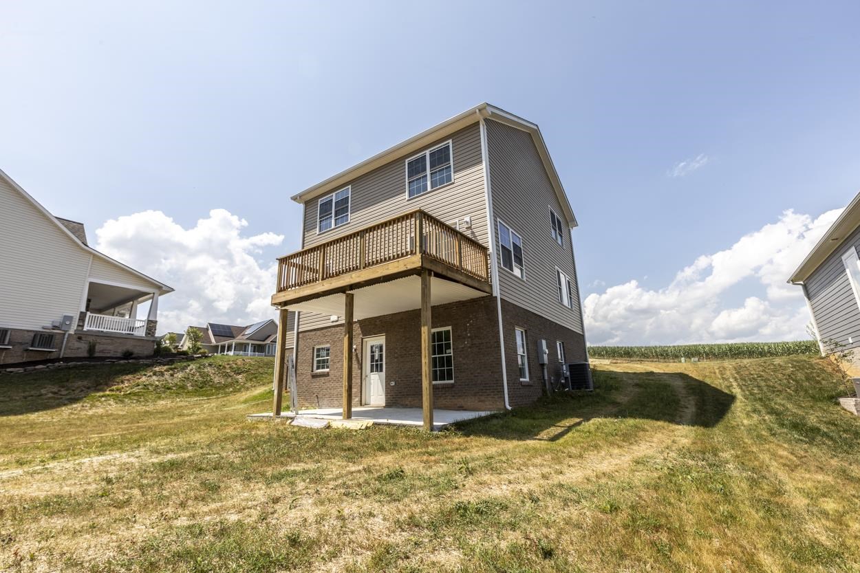 125 Rhodes Hill Drive Dayton, VA 22821 - Photo 5 of 37 a front view of a house with a yard
