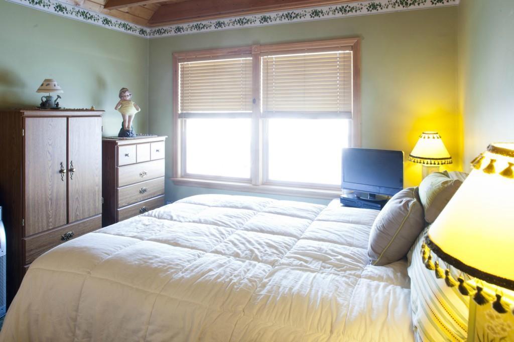 494 Springy Pond Road Ellsworth, ME 04605 - Photo 22 of 34 1st floor bedroom looks out to the water