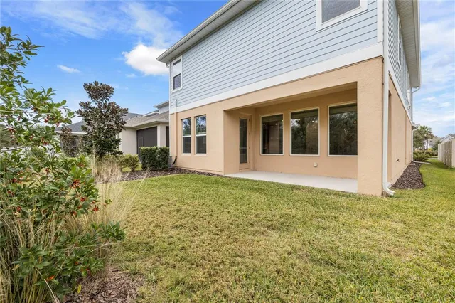 a bathroom with a double vanity sink mirror and bathtub