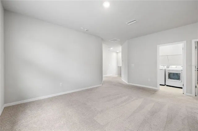 a bathroom with a sink double vanity mirror and a bathtub