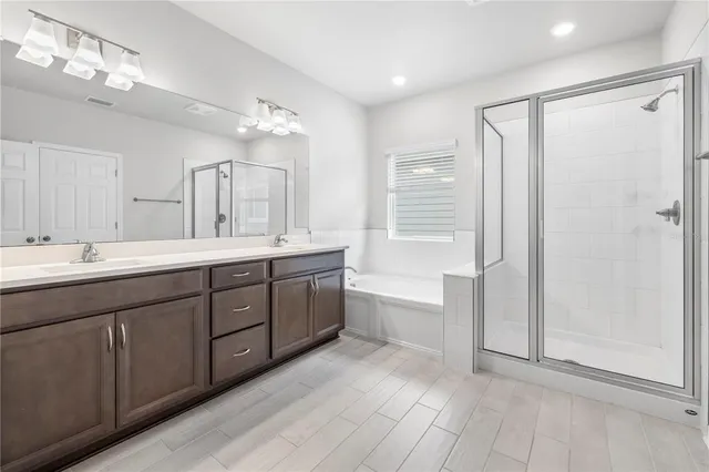 an aerial view of residential houses with outdoor space and river