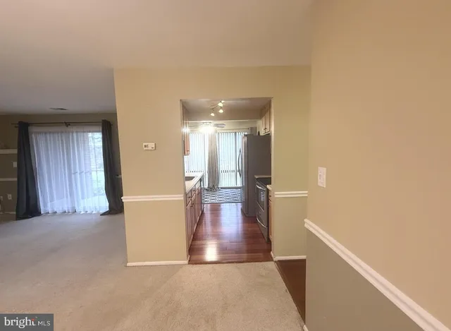 a view of an empty room and a window