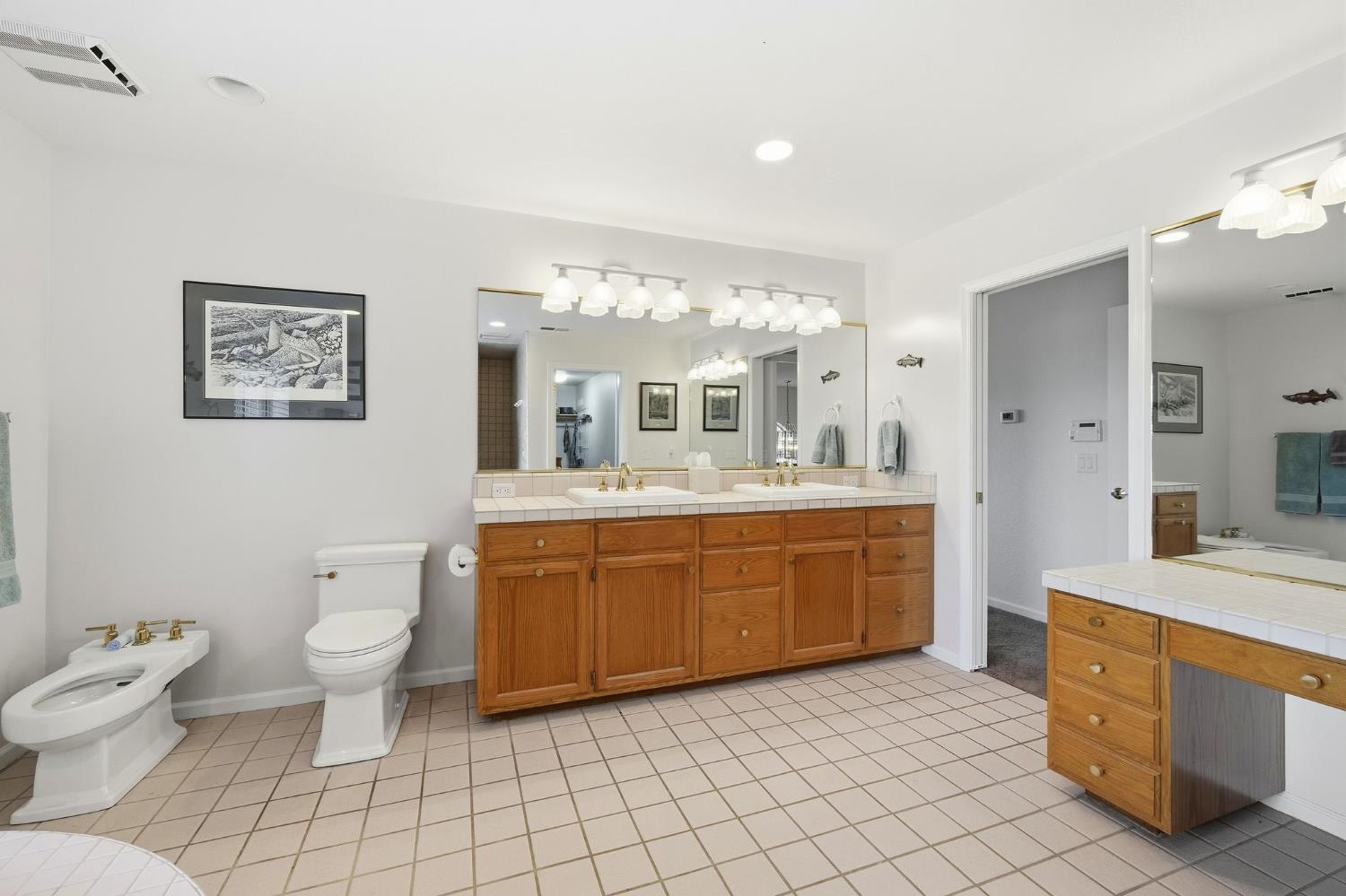 6380 Landmark Place Stockton, CA 95215 - Photo 16 of 39 a spacious bathroom with a double vanity sink mirror and toilet