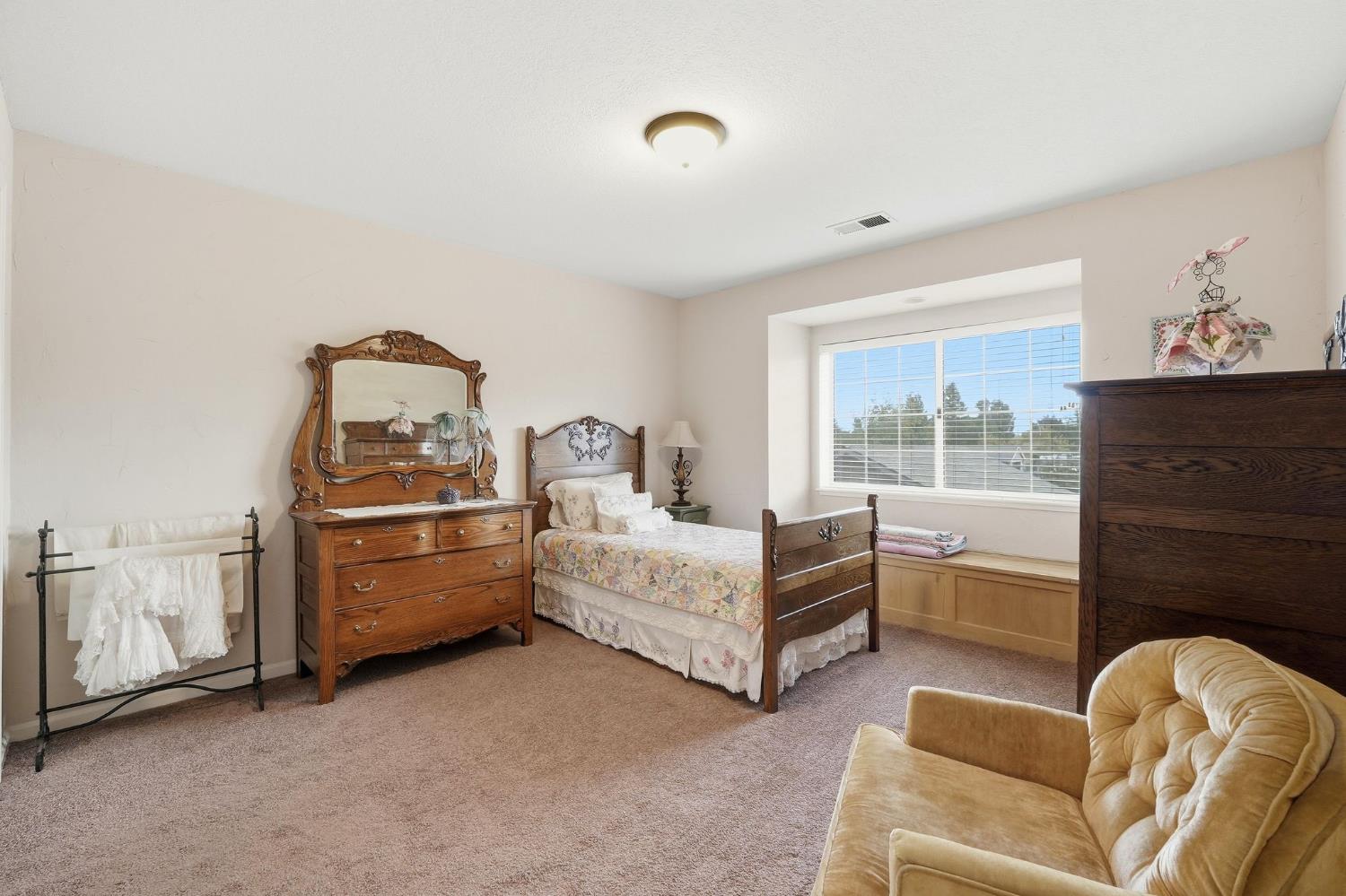 6380 Landmark Place Stockton, CA 95215 - Photo 17 of 39 a bedroom with furniture and window