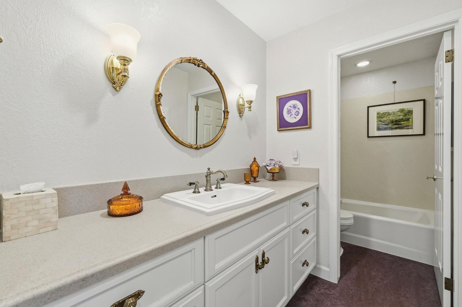 6380 Landmark Place Stockton, CA 95215 - Photo 20 of 39 a bathroom with a granite countertop sink mirror and vanity