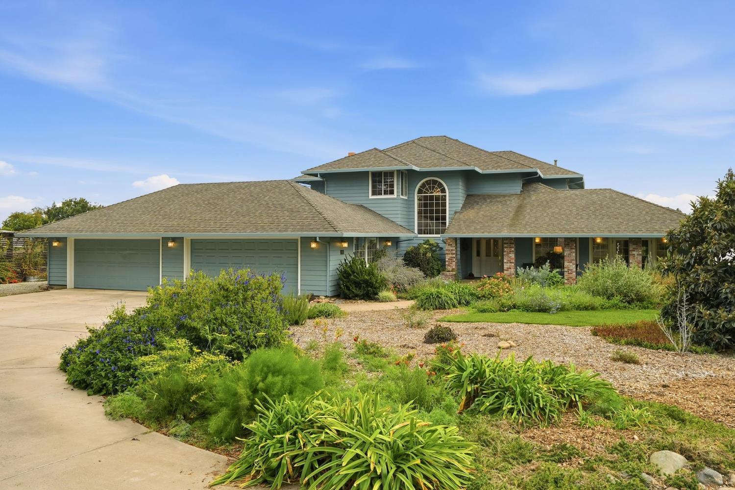 6380 Landmark Place Stockton, CA 95215 - Photo 2 of 39 a front view of a house with a yard