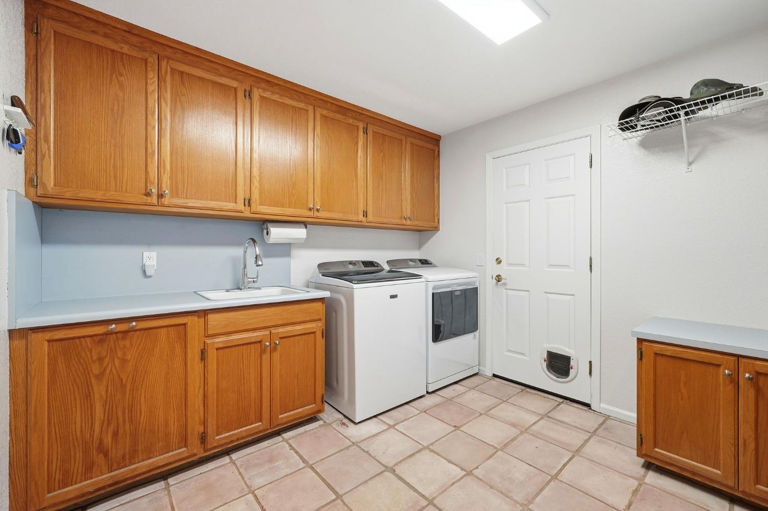 6380 Landmark Place Stockton, CA 95215 - Photo 21 of 39 a view of a storage and utility room with washer and dryer
