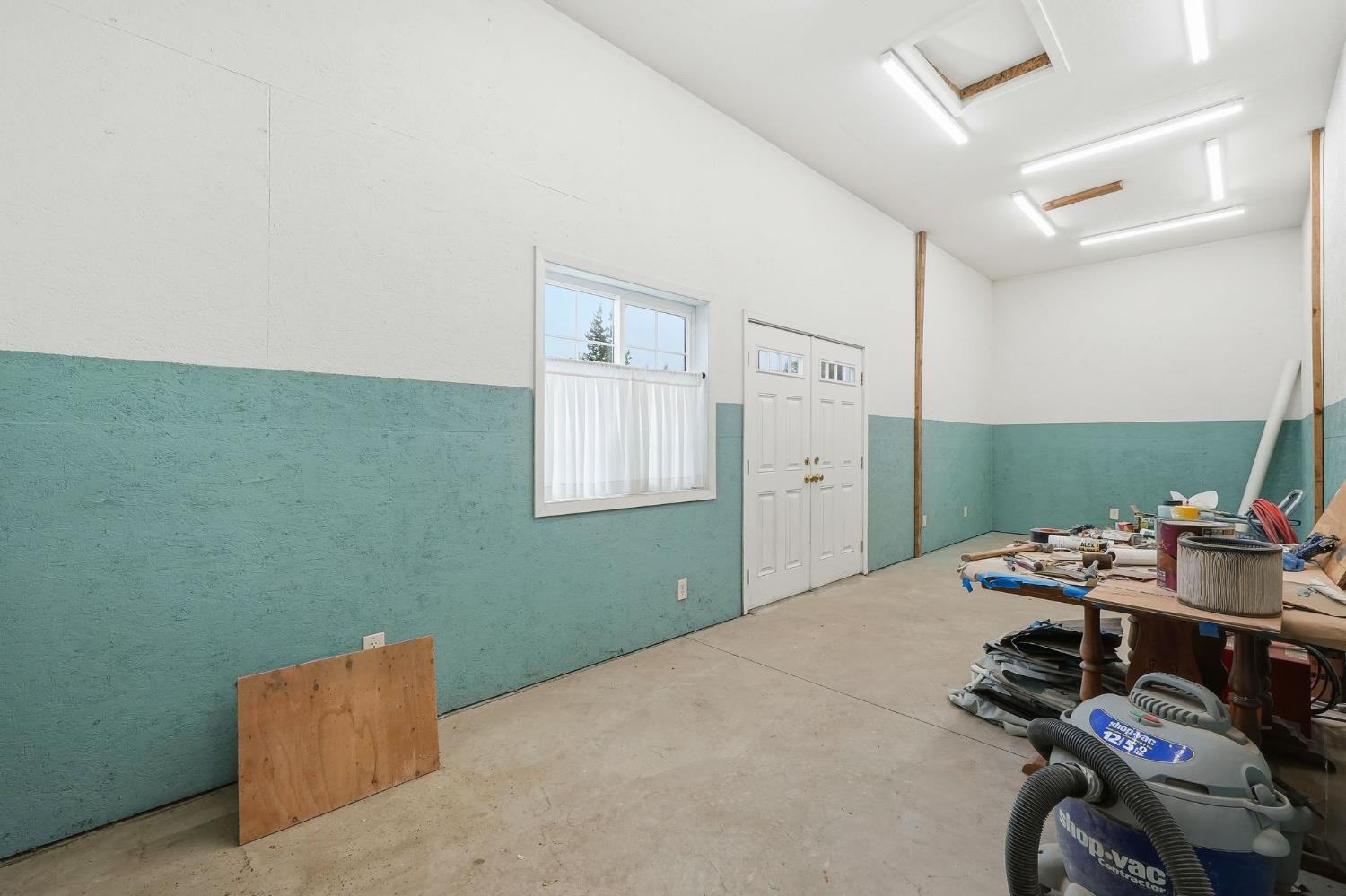 6380 Landmark Place Stockton, CA 95215 - Photo 25 of 39 a bedroom with a bed and a table in it