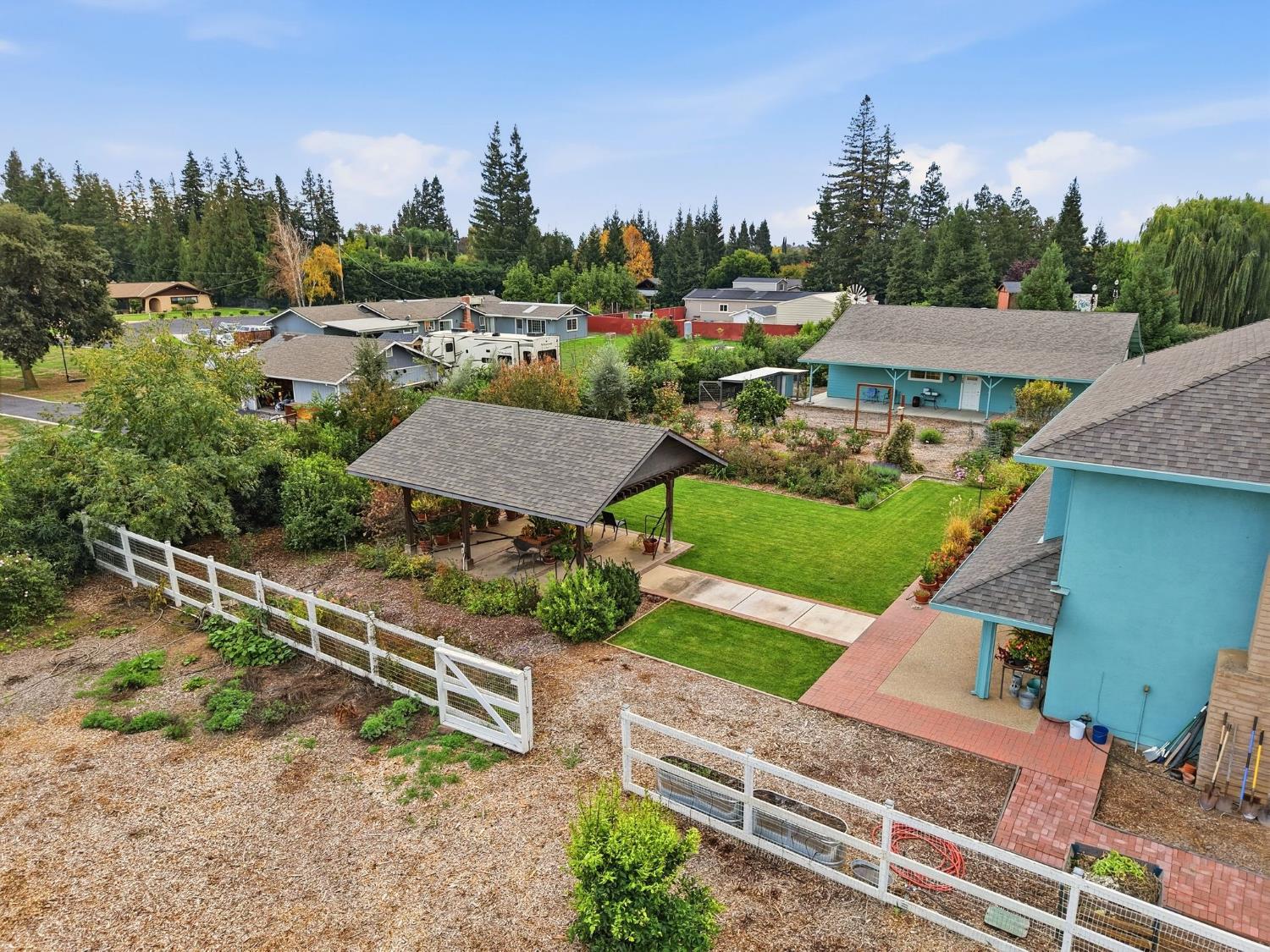 6380 Landmark Place Stockton, CA 95215 - Photo 37 of 39 an aerial view of a house with a garden and trees