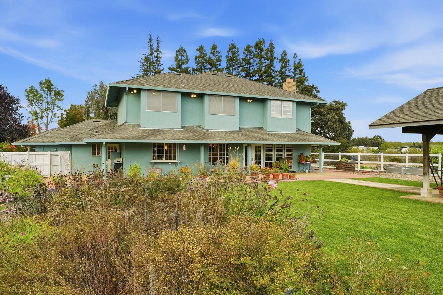 6380 Landmark Place Stockton, CA 95215 - Photo 39 of 39 a front view of a house with a garden