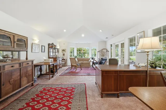a living room with lots of furniture and window