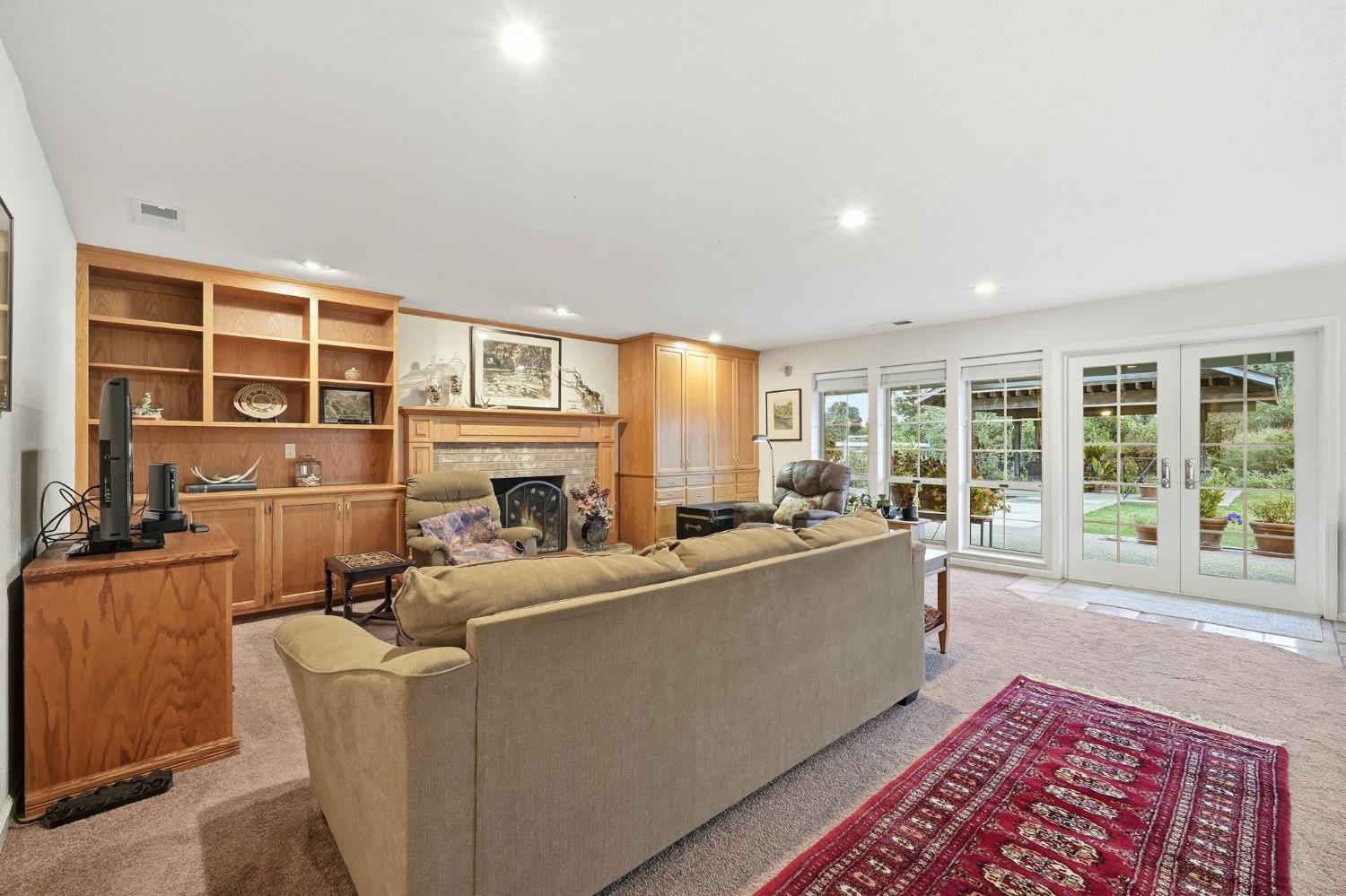 6380 Landmark Place Stockton, CA 95215 - Photo 8 of 39 a living room with furniture and a fireplace