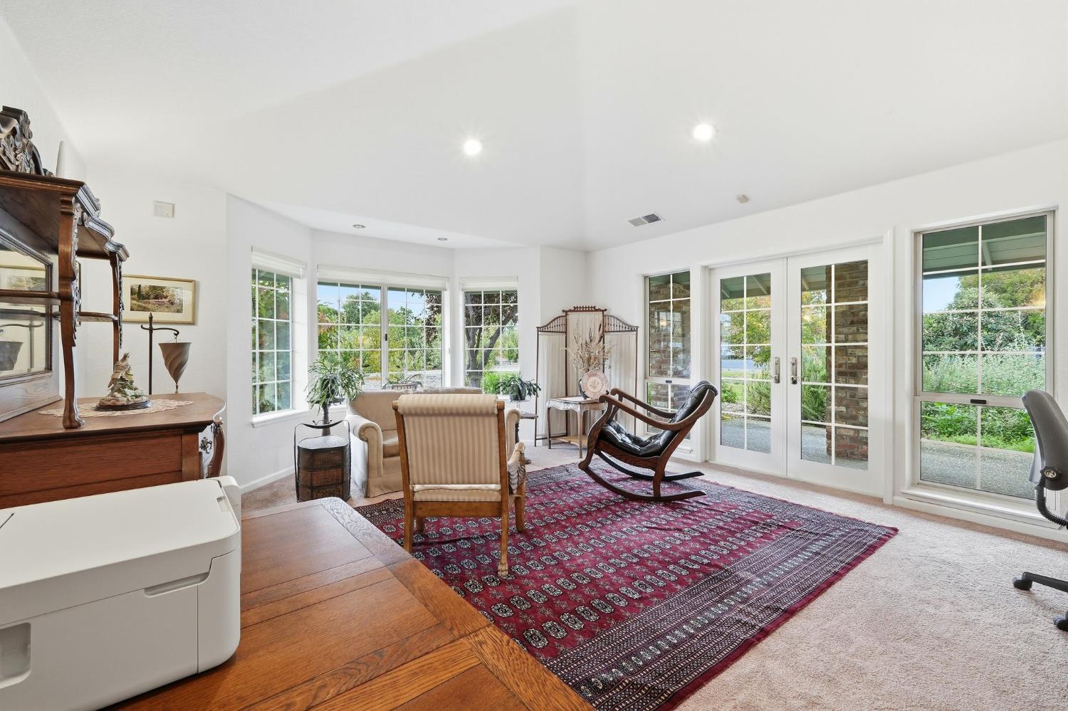 6380 Landmark Place Stockton, CA 95215 - Photo 9 of 39 a living room with furniture a rug table and a large window