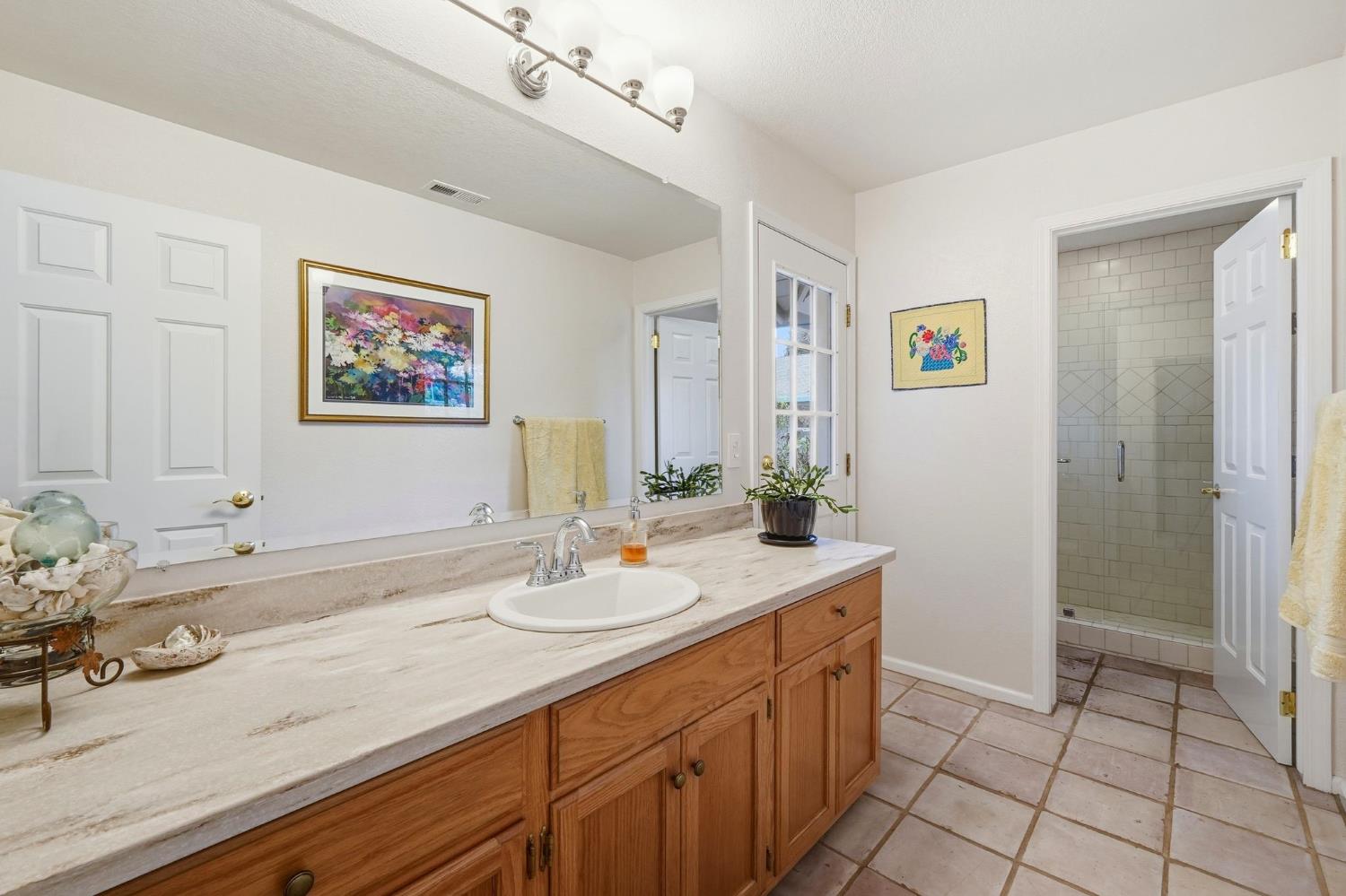 6380 Landmark Place Stockton, CA 95215 - Photo 10 of 39 a bathroom with a sink a vanity and a mirror