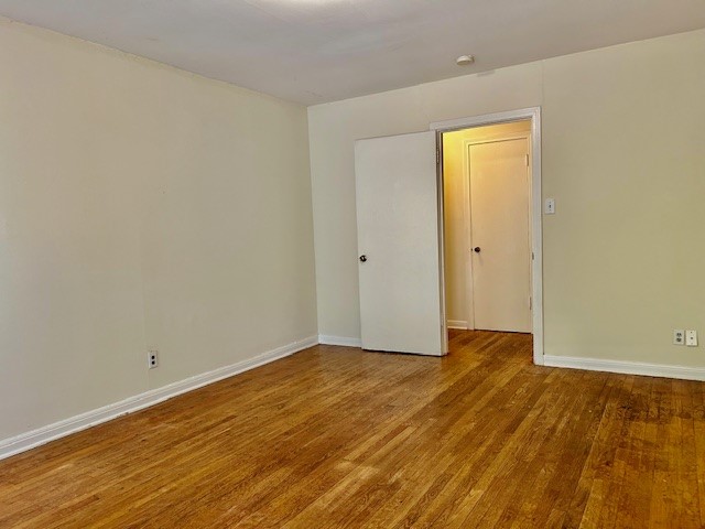 923 Keith Lane Austin, TX 78705 - Photo 11 of 21 a view of an empty room and wooden floor