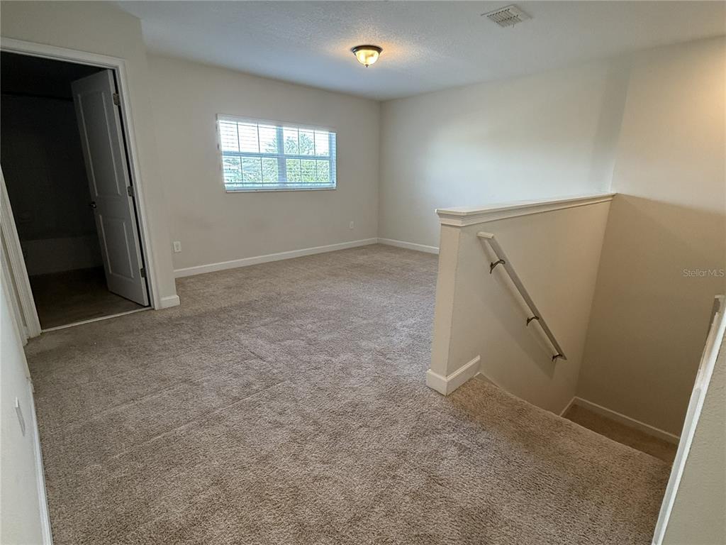 11818 Epic Avenue Orlando, FL 32832 - Photo 15 of 28 an empty room with windows