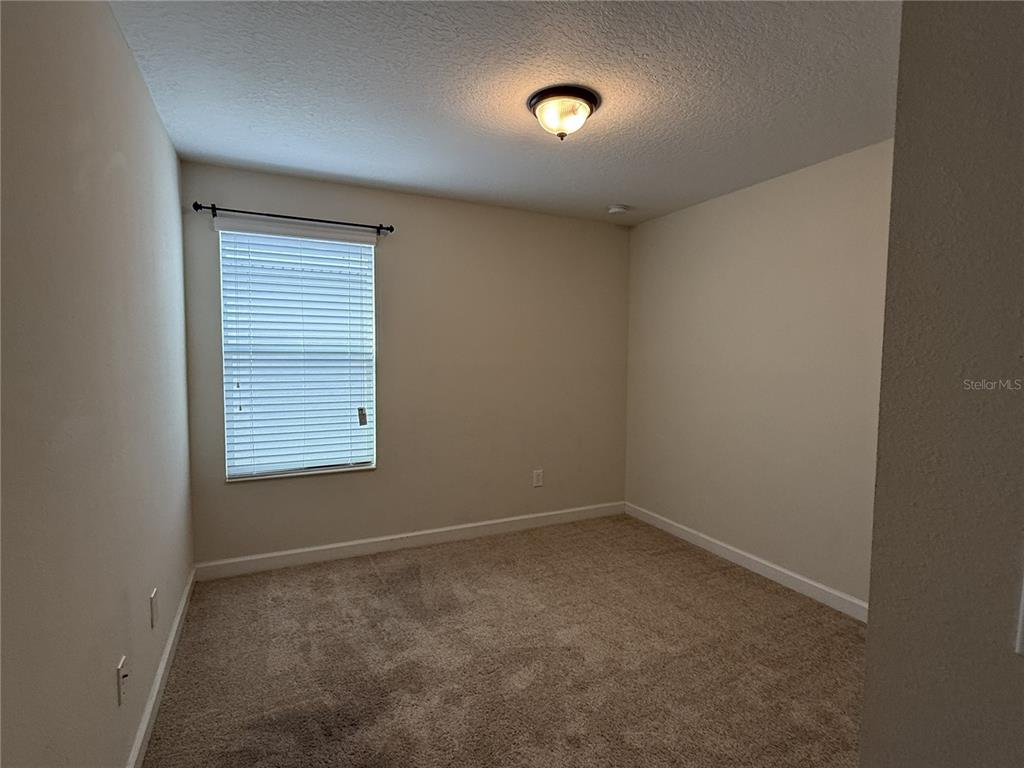 11818 Epic Avenue Orlando, FL 32832 - Photo 17 of 28 an empty room with a empty space and windows