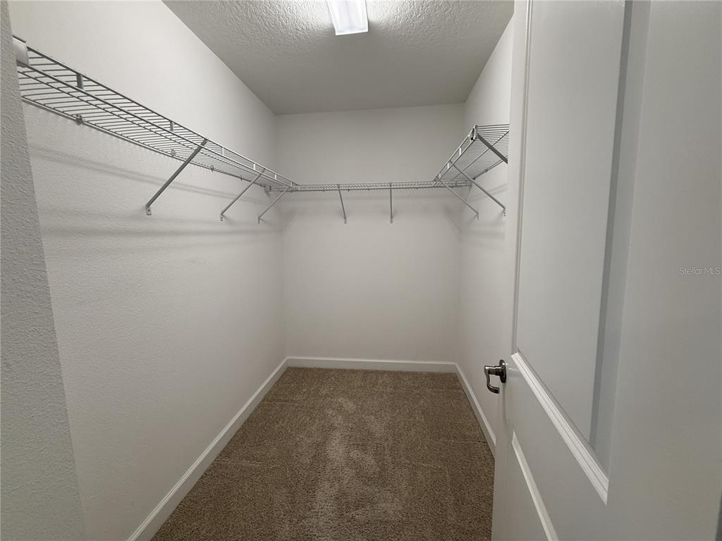 11818 Epic Avenue Orlando, FL 32832 - Photo 20 of 28 a view of a room with racks on the wall