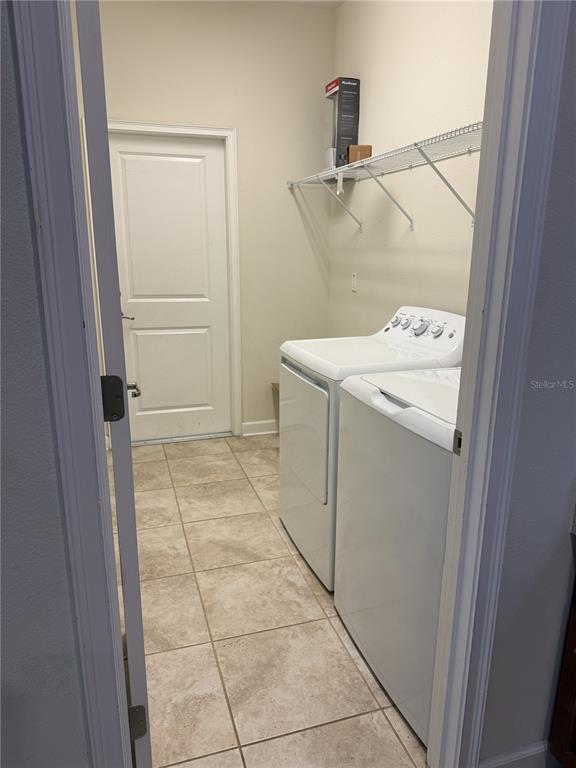 11818 Epic Avenue Orlando, FL 32832 - Photo 7 of 28 a utility room with dryer and washer