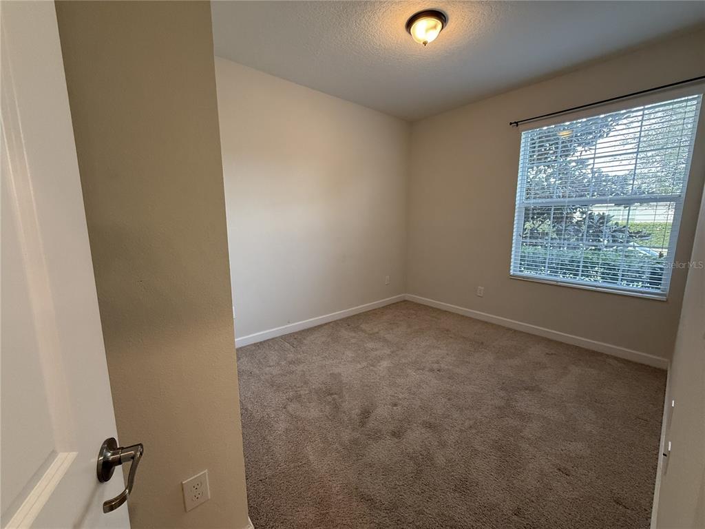 11818 Epic Avenue Orlando, FL 32832 - Photo 9 of 28 an empty room with a window