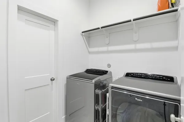 a spacious bathroom with a sink shower and a mirror