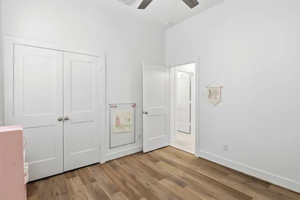 a bedroom with furniture and a book shelf