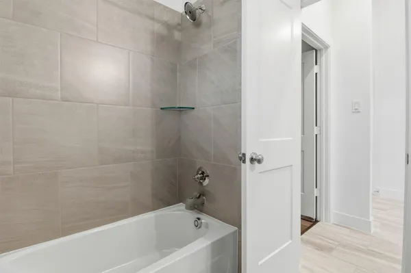 a bathroom with a sink toilet and a mirror