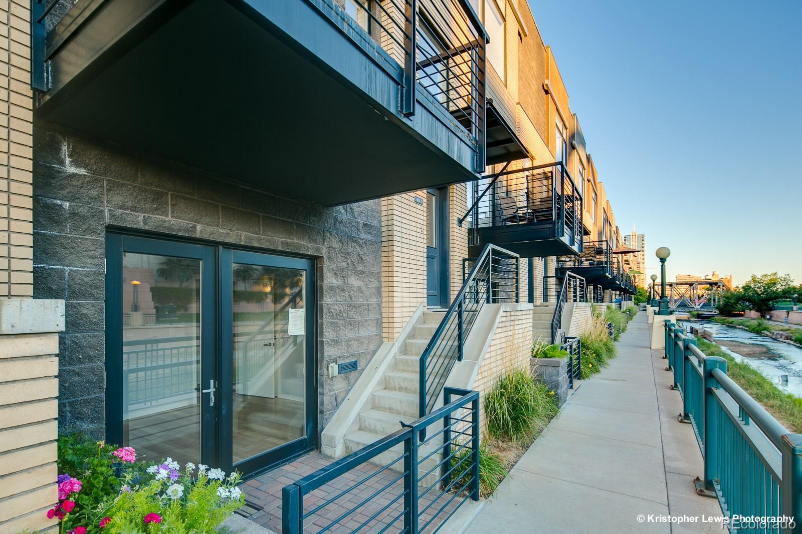 1400 Little Raven Street, Unit B Denver, CO 80202 - Photo 1 of 35 a view of a house with a yard