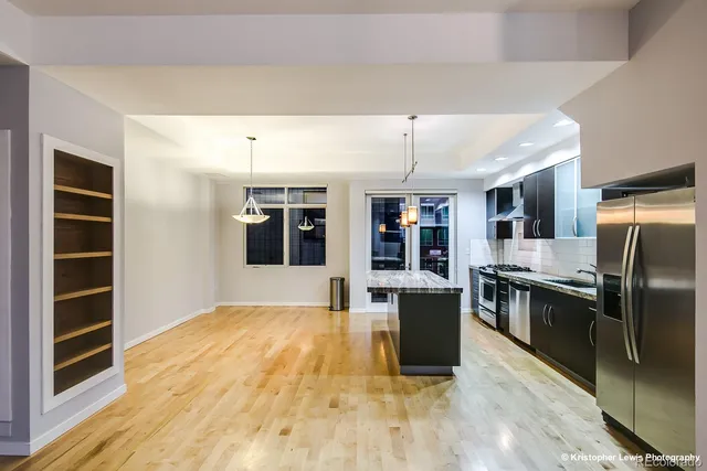 a kitchen with stainless steel appliances granite countertop a stove and a sink