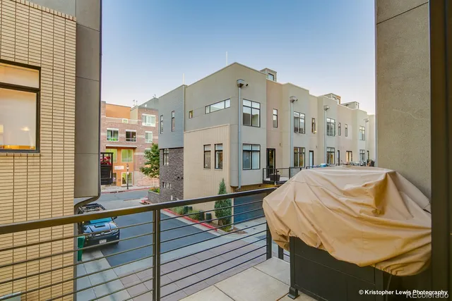 a kitchen with stainless steel appliances granite countertop a stove and a wooden floor