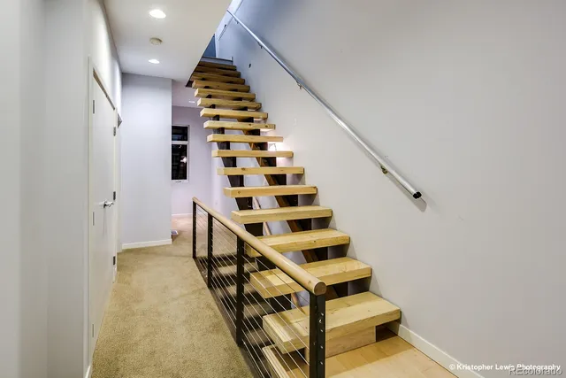 an empty room with window and ceiling fan