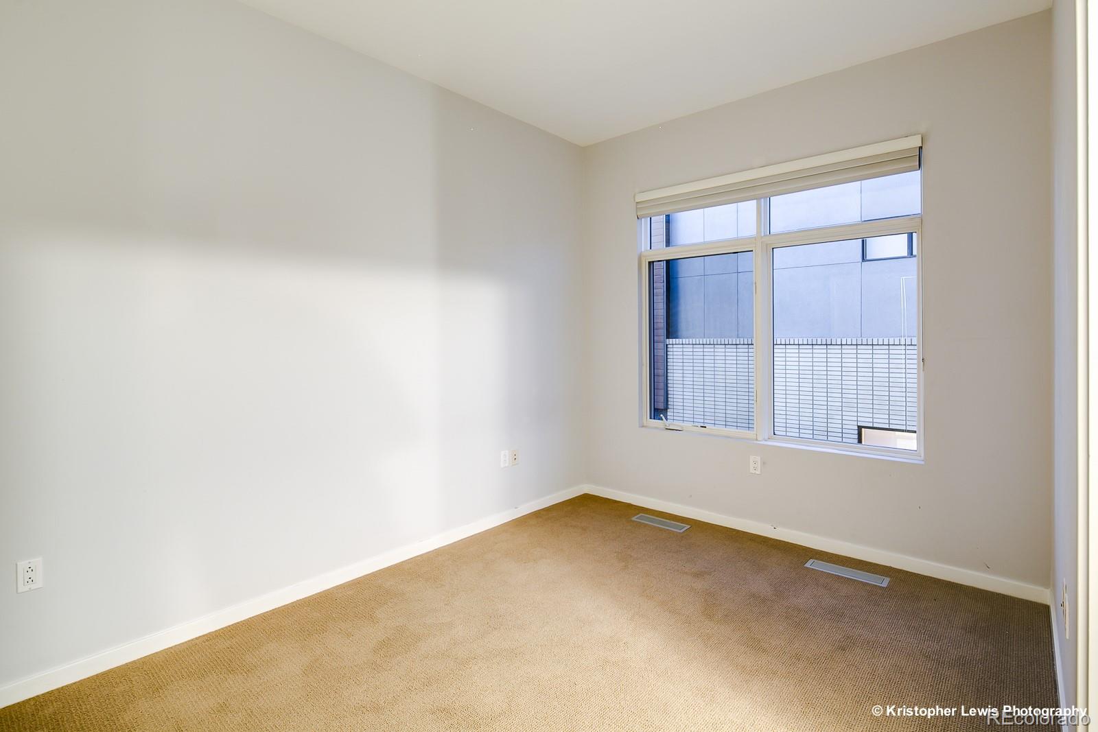 1400 Little Raven Street, Unit B Denver, CO 80202 - Photo 25 of 35 an empty room with a window