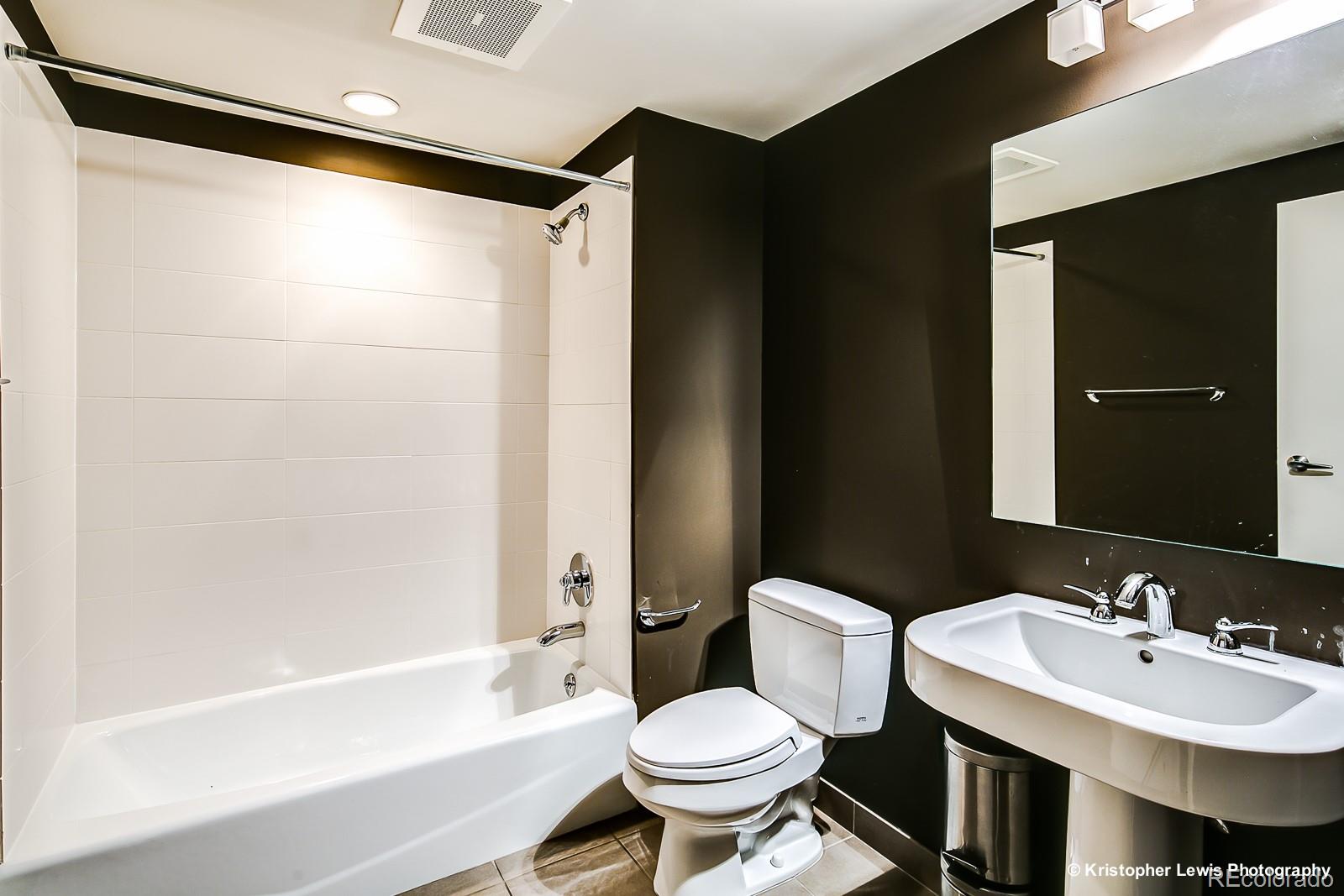 1400 Little Raven Street, Unit B Denver, CO 80202 - Photo 31 of 35 a bathroom with a sink toilet and shower