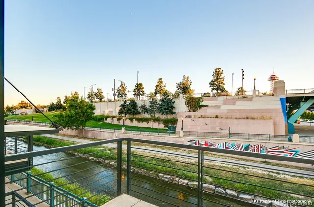 a roof deck with table and chairs a barbeque