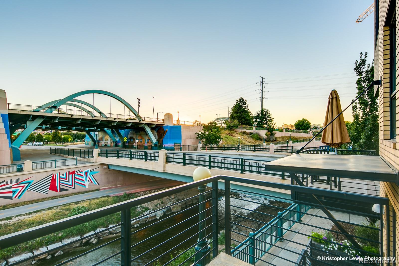 1400 Little Raven Street, Unit B Denver, CO 80202 - Photo 6 of 35 a roof deck with table and chairs a barbeque