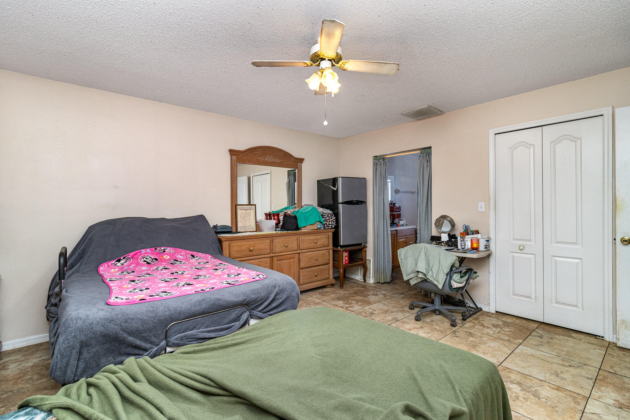 697 Furth Road Northwest Palm Bay, FL 32907 - Photo 10 of 24 a bedroom with a bed and a chandelier