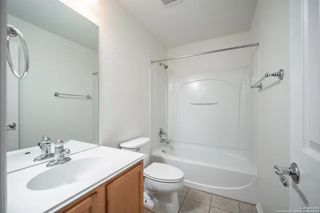 a bathroom with a sink toilet tub and shower