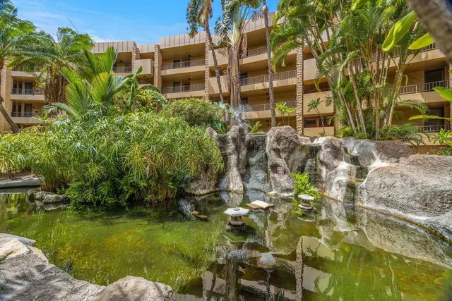 a backyard of a building with yard