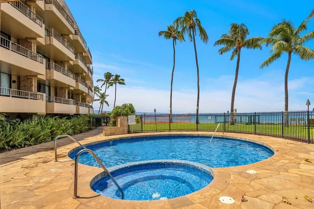 a view of swimming pool with outdoor seating and yard