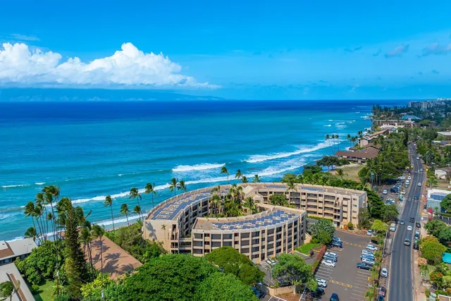 a view of a swimming pool with an outdoor seating