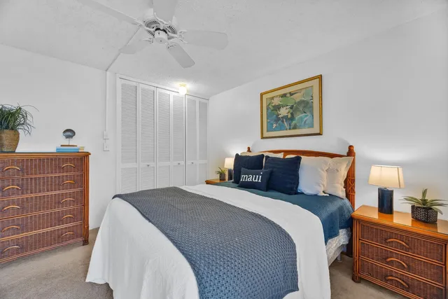 a bedroom with a bed and with furniture