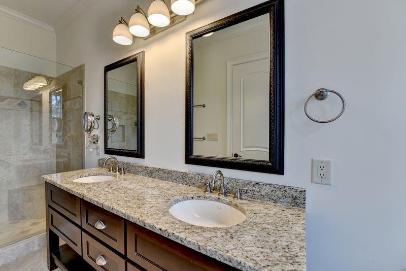 4045 Ridge Road Buford, GA 30519 - Photo 34 of 97 a bathroom with a granite countertop sink and a mirror