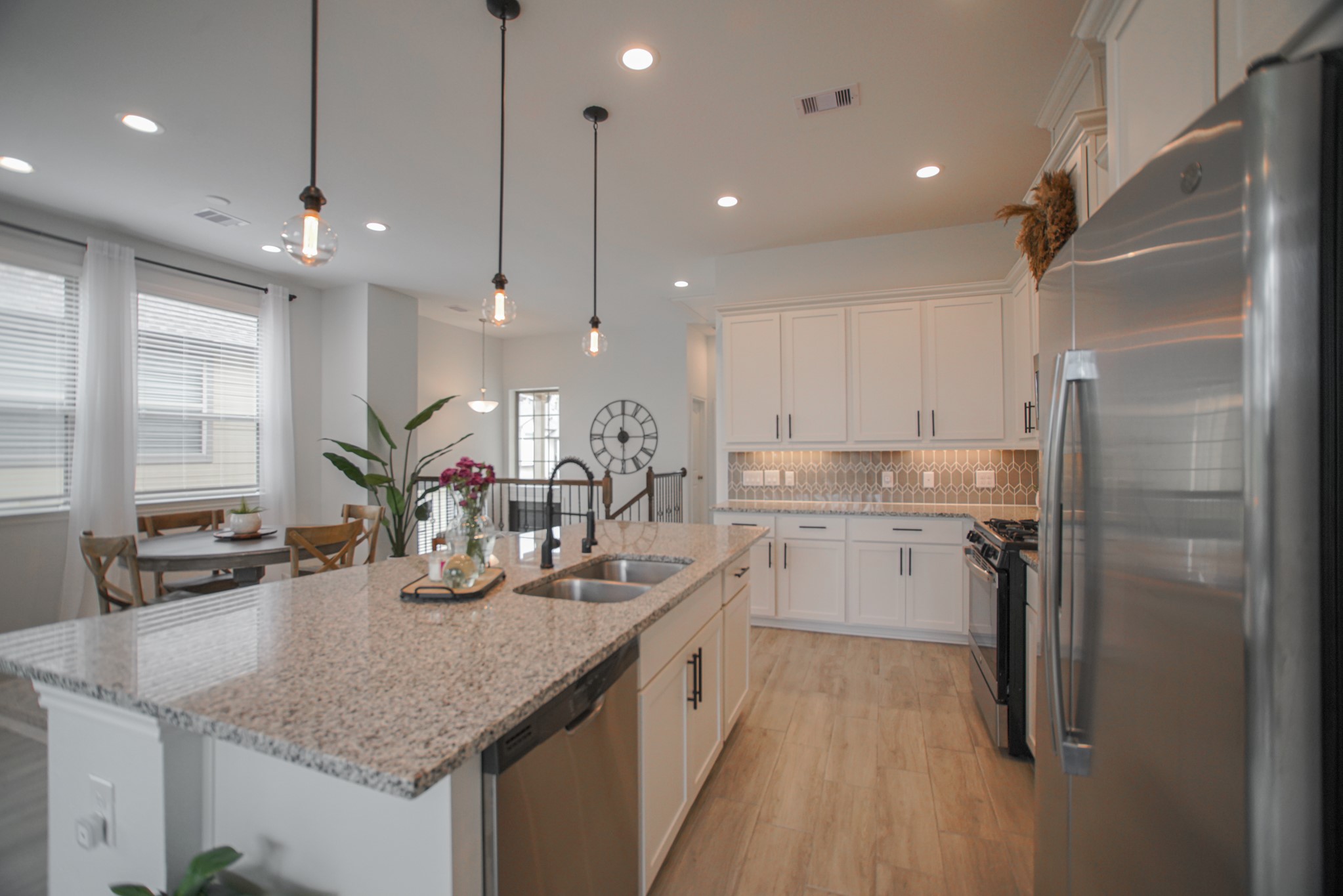 4232 Merry Mill Drive Spring, TX 77386 - Photo 11 of 50 Kitchen windows bring in sunlight while keeping this heart of the home warm, functional, and inviting.