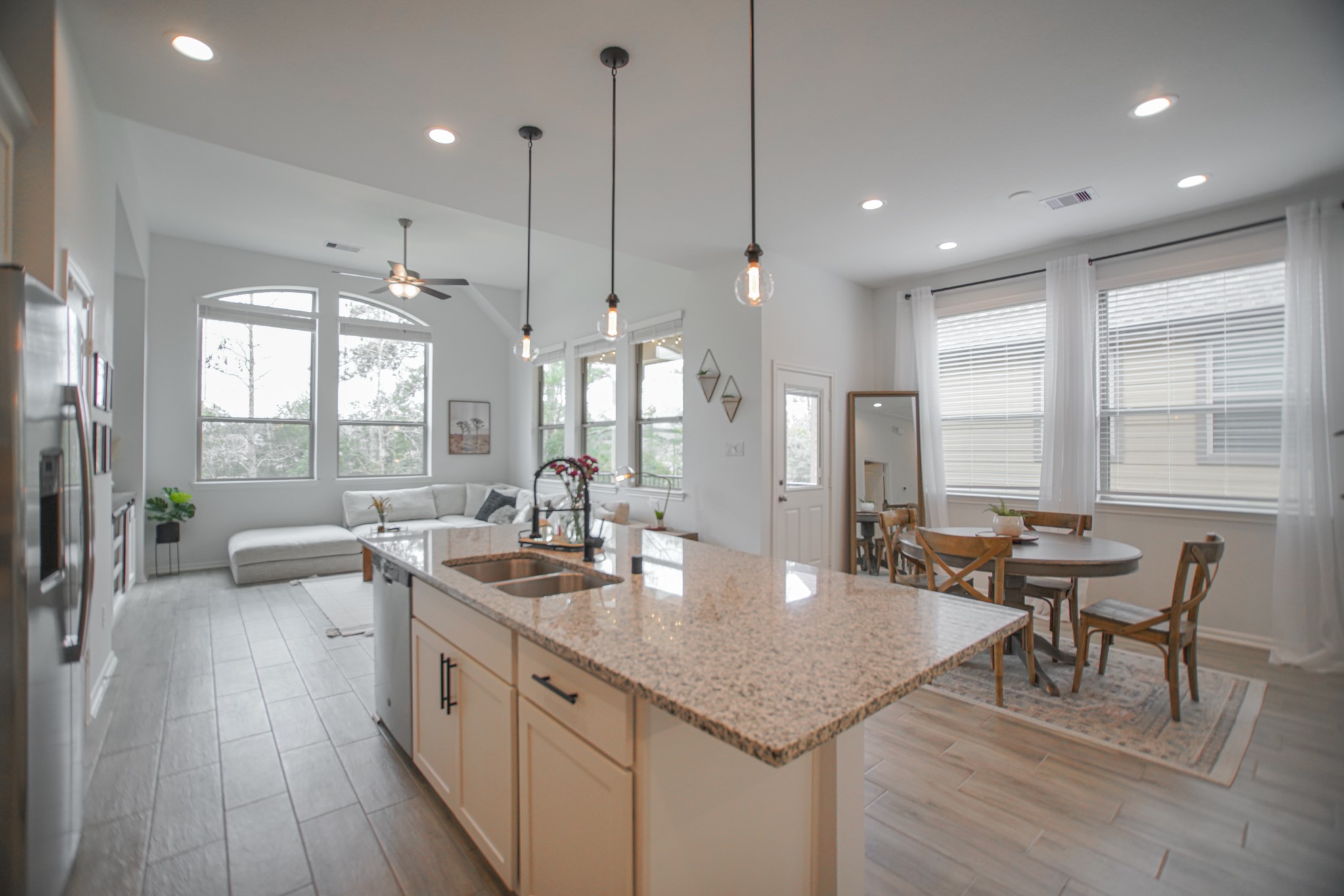 4232 Merry Mill Drive Spring, TX 77386 - Photo 14 of 50 Open-concept living allows seamless flow from kitchen, dining & family spaces for today’s modern lifestyle.